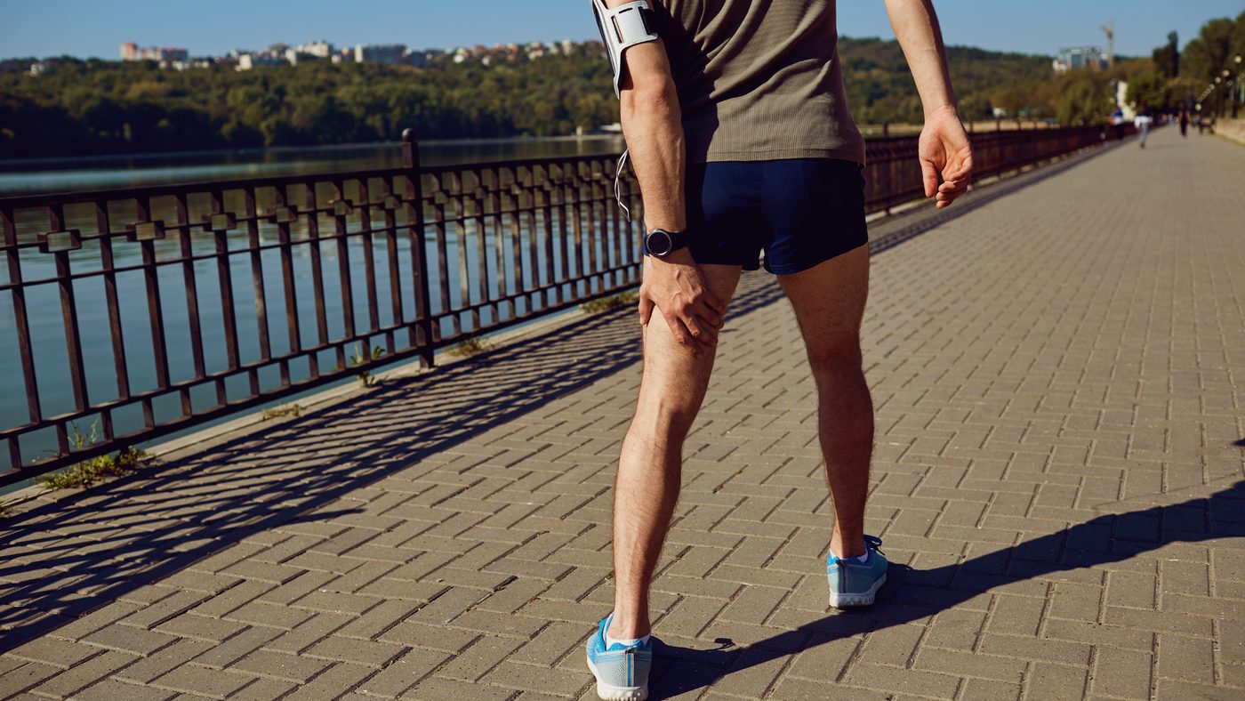 A runner on a waterside promenade